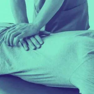 back in action olympia full chiropractic service chiropractor adjusting lower back as part of Dr. Tim's full service chiropractic in olympia wa