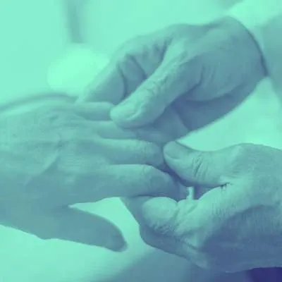 back in action olympia neuropathy chiropractic service A gentle hand holding another