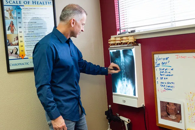 Dr. McConnell Looking at a spinal X-ray